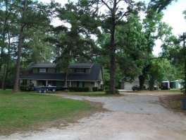 Unrestricted Conroe Acreage With Improvements (can convert to office/industrial)